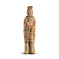 A painted pottery figure of a standing official, northern wei dynasty (386-535)