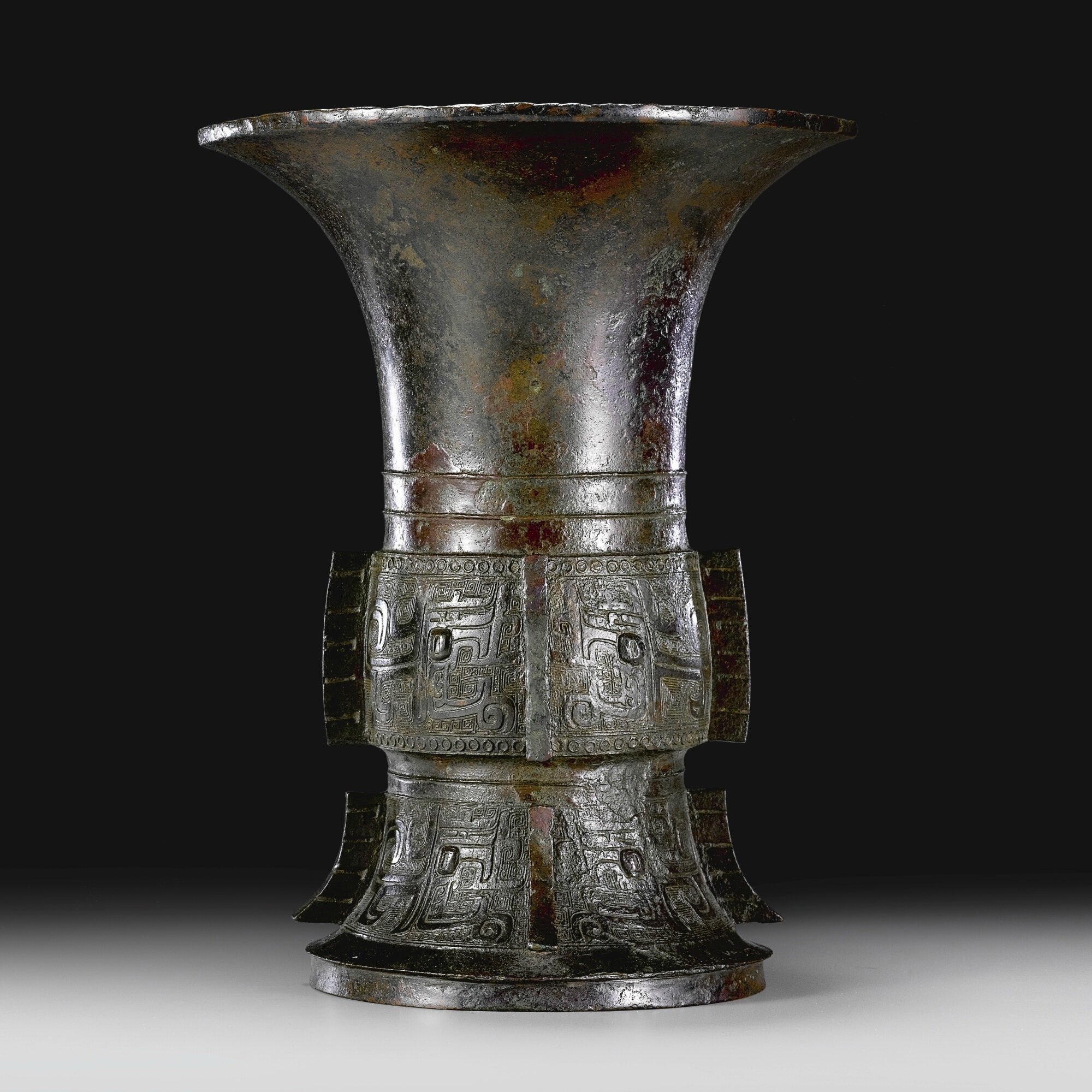 An archaic bronze ritual wine vessel, zun, Late Shang dynasty-Early Western Zhou dynasty, 11th century BC
