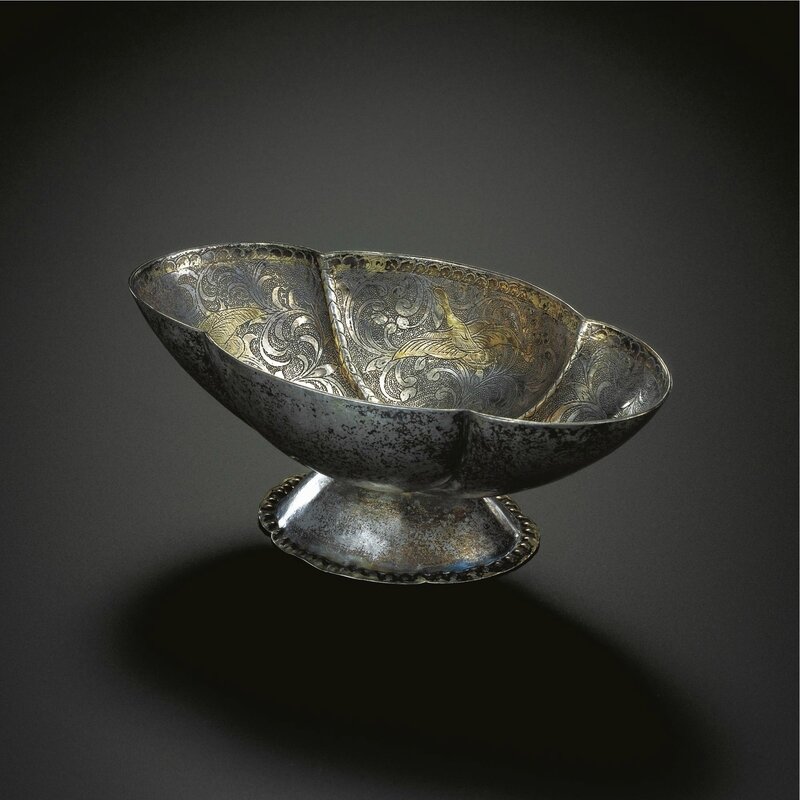 A rare begonia-shaped parcel-gilt silver stembowl, Tang dynasty, 8th century