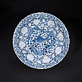 A Unique and Highly Important Moulded Blue and White Barbed 'Fish' Charger, Yuan Dynasty (1271-1368)