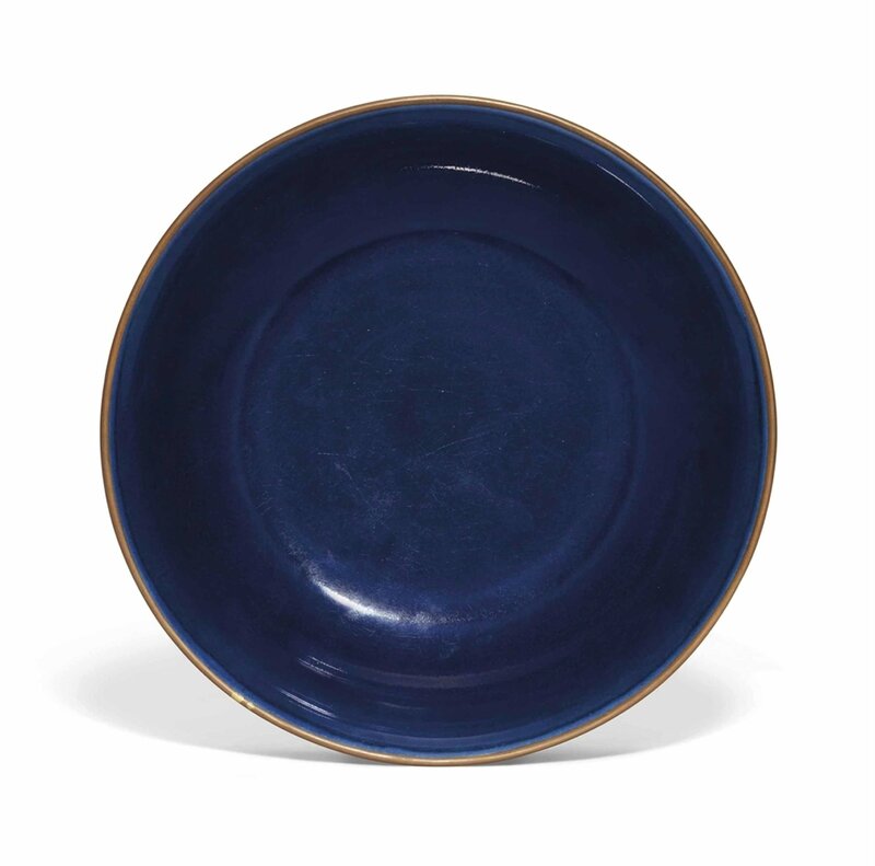 A rare early Ming blue-glazed dish, Xuande incised six-character mark within double circles and of the period (1426-1435)