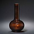 A transparent amber glass bottle vase. Incised Qianlong seal mark and of the period © 2002-2010 Bonhams 1793 Ltd