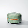 A Longquan celadon carved patterned circular box and cover, Yuan dynasty (1279-1368)