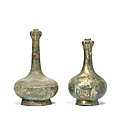 Two archaic bronze garlic-head vases, hu, han dynasty