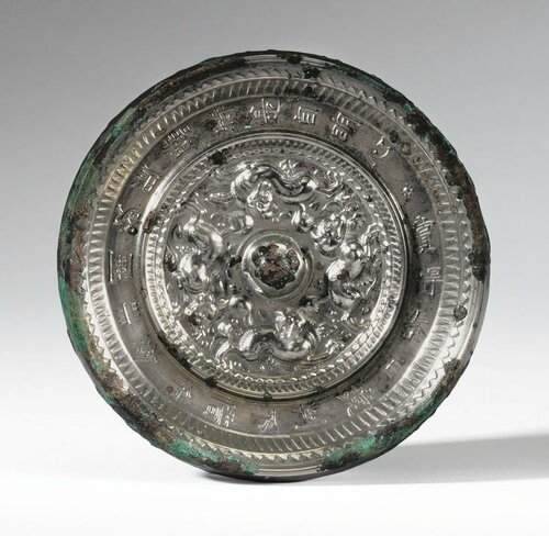 AN INSCRIBED 'MYTHICAL BEASTS' BRONZE MIRROR, SUI DYNASTY