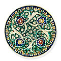 A kubachi rimless pottery dish, probably tabriz, north west iran, 17th century