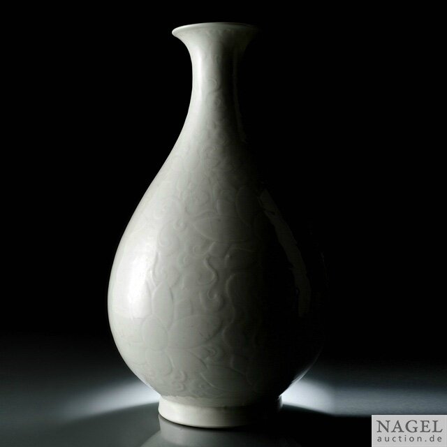 A very fine and rare imperial incised and molded milky-white glazed Ding-style yuhuchun ping, China, incised Yongzheng six-character seal mark and period