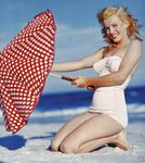 1949_tobey_beach_by_dedienes_umbrella_red_071_2
