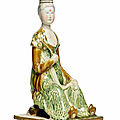 A rare sancai-glazed pottery figure of a court lady, Tang dynasty (618-907)