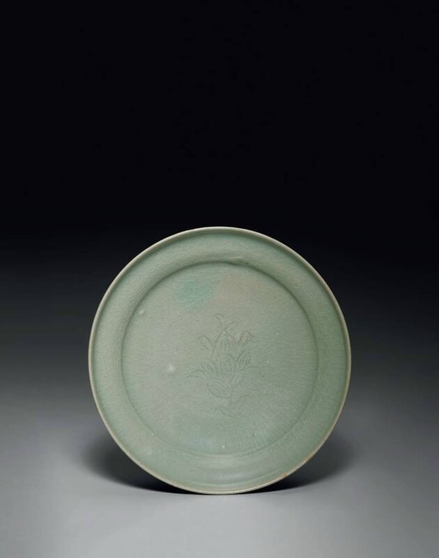 An incised Korean celadon footed dish, Goryeo dynasty, 12th-13th century