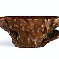 A rhinoceros horn 'imitation burlwood' libation cup, qing dynasty, 17th-18th century 