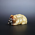 A yellow and russet jade recumbent dog, ming dynasty or later
