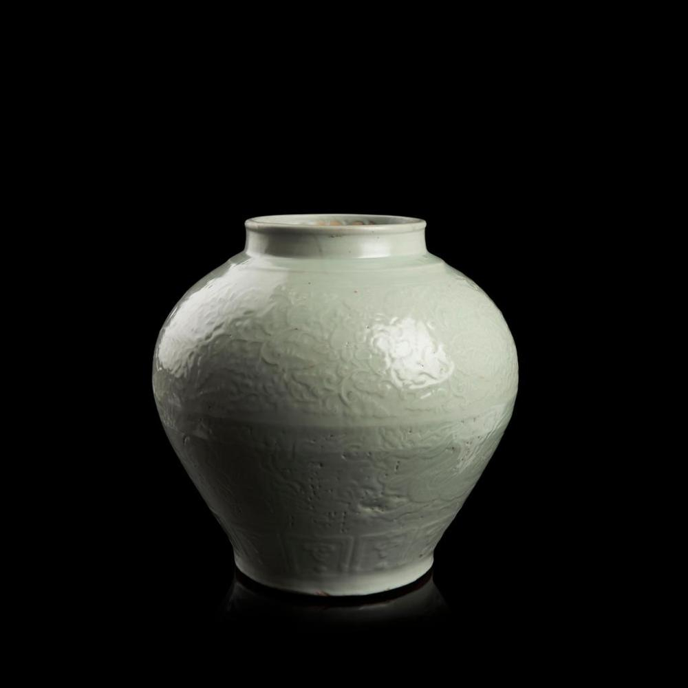 Rare white-glazed and carved 'dragon' jar, inscribed Run Yuan, late Yuan-early Ming dynasty