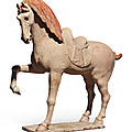 ﻿A large painted pottery figure of a prancing horse, Tang dynasty (618-907)