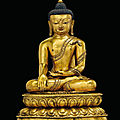 A rare and important gilt-bronze figure of buddha shakyamuni, tibet, early 15th century