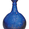 An intact kashan blue-glazed bottle vase, persia, 12th-13th century