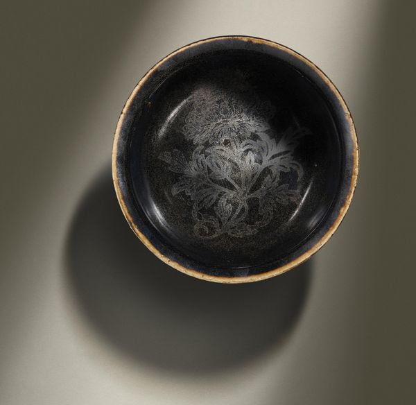 An extremely rare Dingyao gilt-decorated black-glazed 'floral' bowl, Northern Song Dynasty