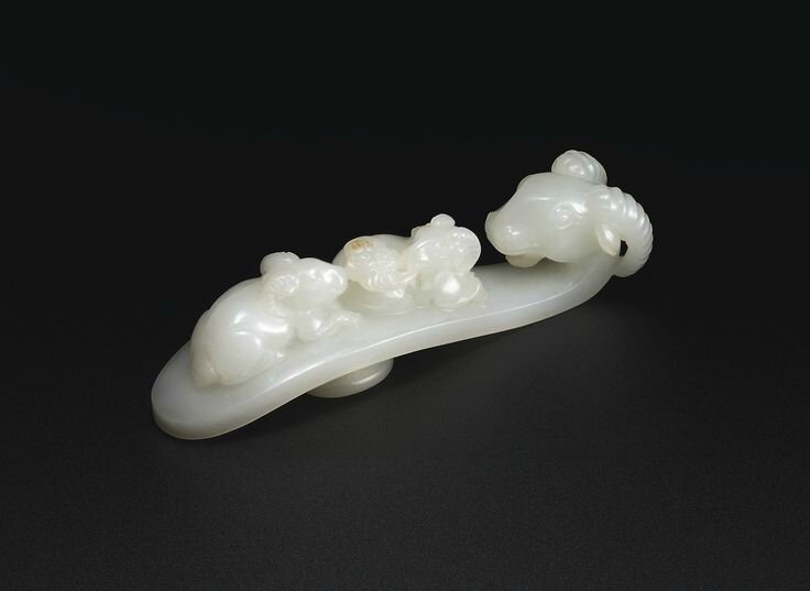 A White Jade ‘Three Rams’ Belt Buckle Qing Dynasty, 18th Century