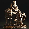 An extremely rare imperial carved and inscribed boxwood 'manjushri and lion' group, seal mark and period of qianlong, 1761