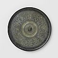 Bronze mirror with stylized bird-dragon motifs, Han dynasty, 200-100 BCE