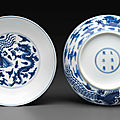 A pair of blue and white 'dragon and phoenix' dishes, kangxi six-character marks and of the period (1662-1722)