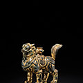 A gilt-bronze lion-form incense holder, tang dynasty (618-907)