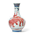 An underglaze blue and copper-red decorated ‘lion’ bottle vase, qing dynasty, late 19th century