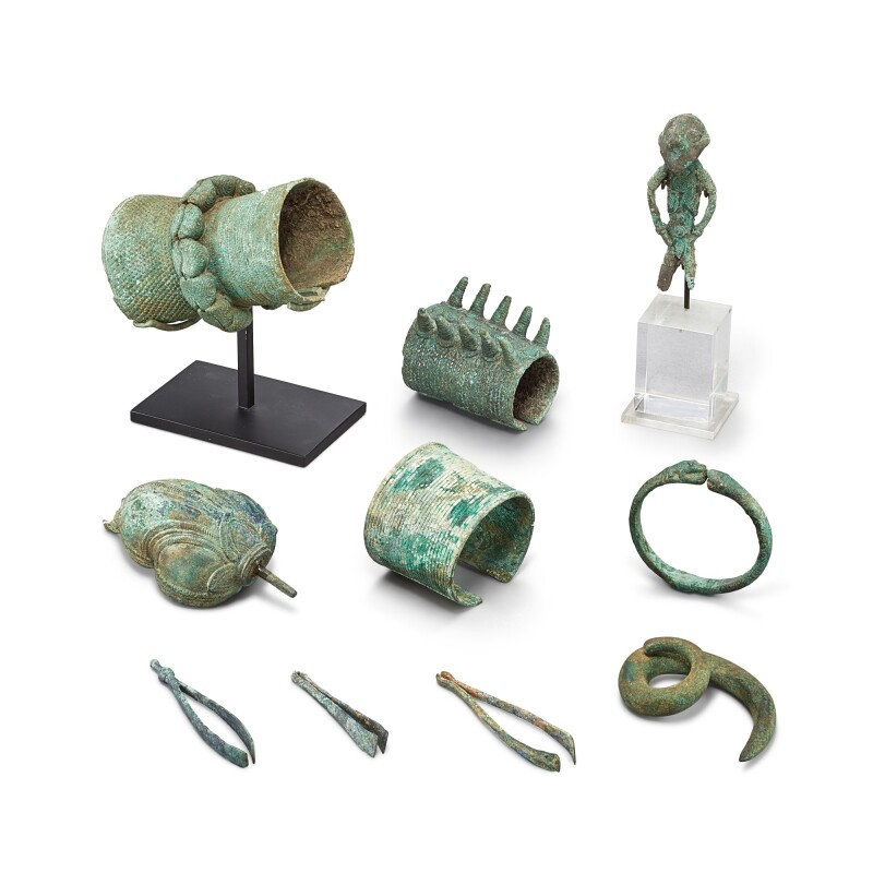 A group of 10 bronze ornaments including a rare 'stargazer' figure, Dong Son culture, 5th – 1st century BCE