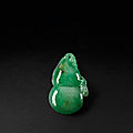 A jadeite double-gourd shaped pendant