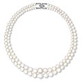 A very rare two-strand natural pearl and diamond necklace