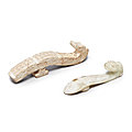 Two calcified jade 'dragon' belt hooks, warring states period or later