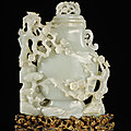 A large white jade 'prunus and lingzhi' vase and cover, qing dynasty, qianlong period