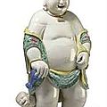 A rare and massive chinese export famille verte figure of a boy. llte 18th/early 19th century. 