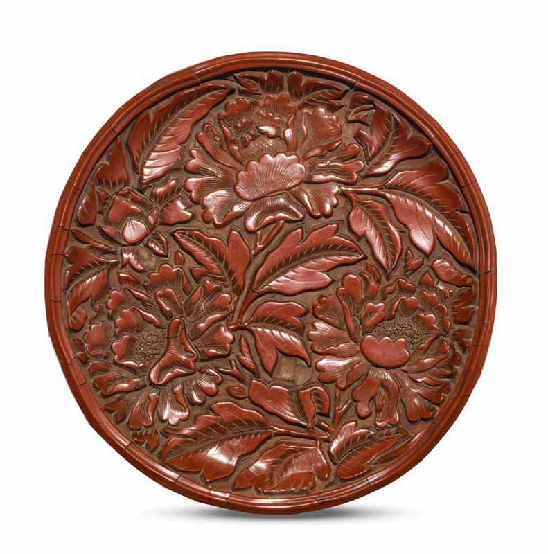 A rare carved cinnabar lacquer 'peony' dish, Second half 14th century