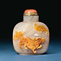 A chinese carved caramel and grey and honey-colour cameo agate snuff bottle, 19th century