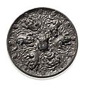 An unusual bronze circular 'lion and grapevine', mirror. tang dynasty (618-907).