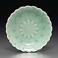 A small celadon-glazed 'lotus' dish, qianlong six-character seal mark in underglaze blue and of the period (1736-1795)