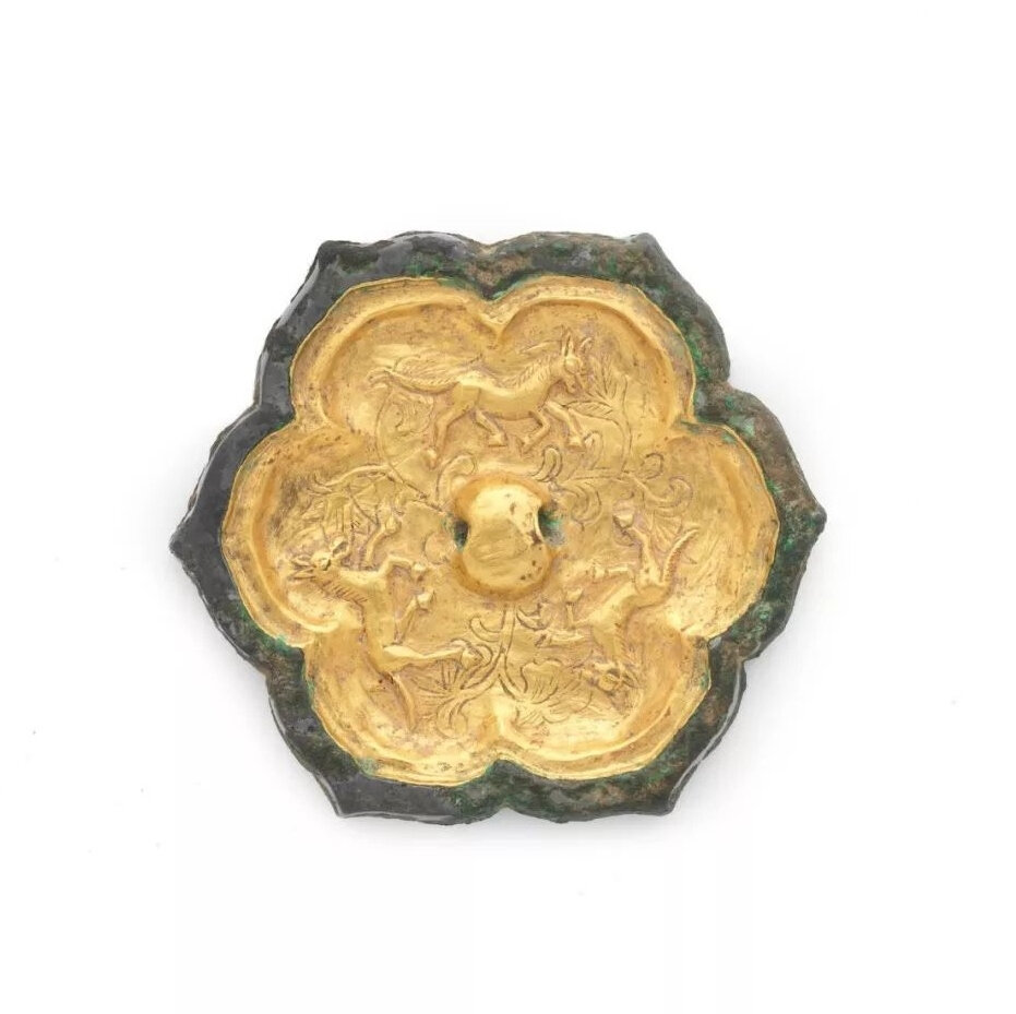 A rare gold-sheet-inlaid bronze foliate mirror, Tang Dynasty (618-907)
