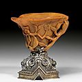 A carved rhinoceros horn libation cup with silver foot, china, 17th century, austria, 19th century