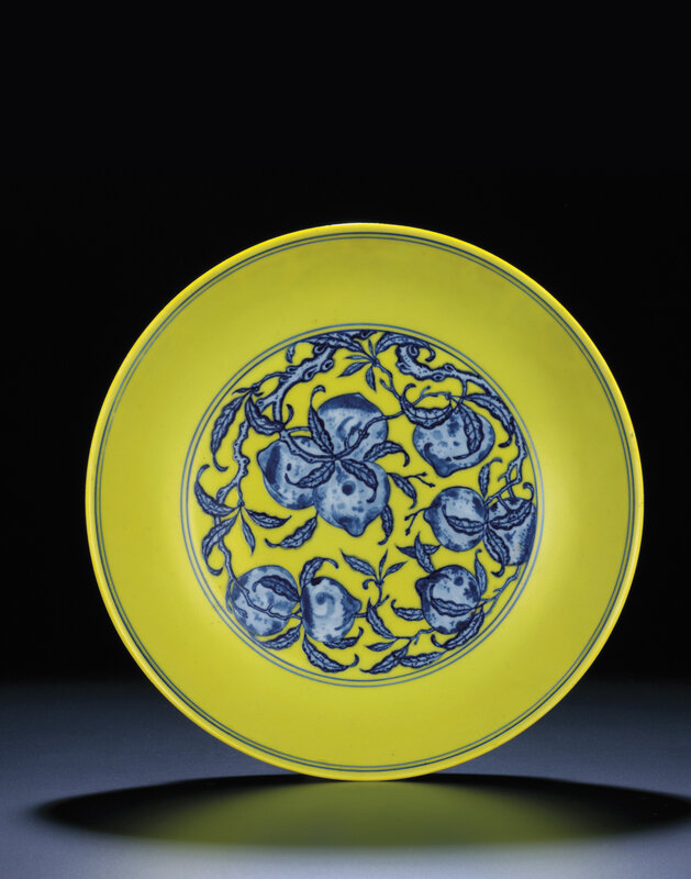 A rare large yellow-ground underglaze-blue 'peach' dish, Qianlong six-character sealmark and of the period (1736-1795)