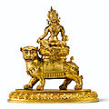 A rare gilt-bronze 'manjusri and lion' group, qing dynasty, 17th century  