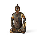 A gilt-lacquered bronze figure of a scholar holding a scroll, song - yuan dynasty