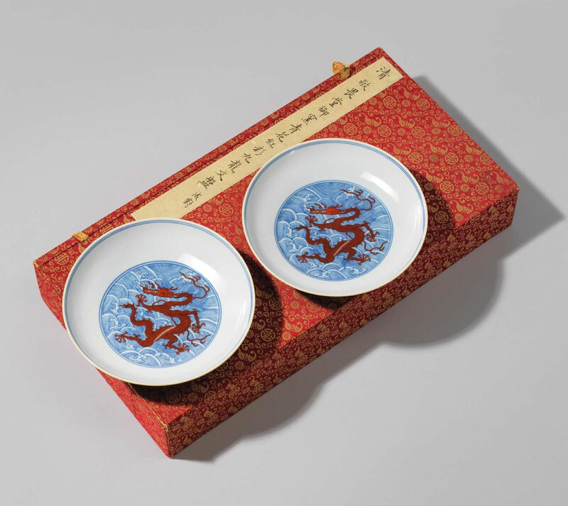 A pair of blue and white and ironred decorated 'Dragon' dishes, Qing