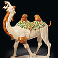 A massive sancai-glazed pottery figure of a striding Bactrian camel, Tang dynasty (AD 618-907)