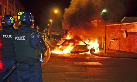 A-car-burns-during-riots--005
