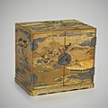 A japanese gold lacquer cabinet with interior drawers with a view of imperial palace garden, circa 1830, late edo period