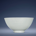 An early Ming white-glazed anhua-decorated bowl, Xuande six-character mark in underglaze blue within a double circle and of the period (1426-1435)