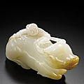 A white jade 'boy climbing on a recumbent buffalo' carving, qing dynasty, 18th-19th century