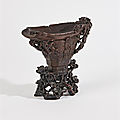 Coupe libatoire en corne de rhinocéros sculptée en haut relief de neuf qilong mouvementés et de motifs archaïsants, , Chine, XVIIIe siècle