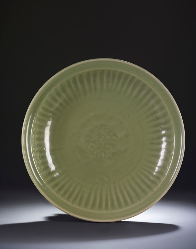 A large Longquan celadon carved 'peony' charger, Ming dynasty, 15th century